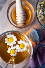 Obraz na płótnie Canvas Chamomile infusion. Floral infusion without caffeine and fresh flowers. Photography of hot drinks