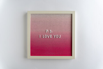 Pink Board Words That Spell P.S. I Love You, on a white background, horizontal