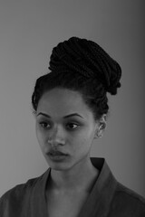 Obraz premium Black and white studio portrait of beautiful curly woman