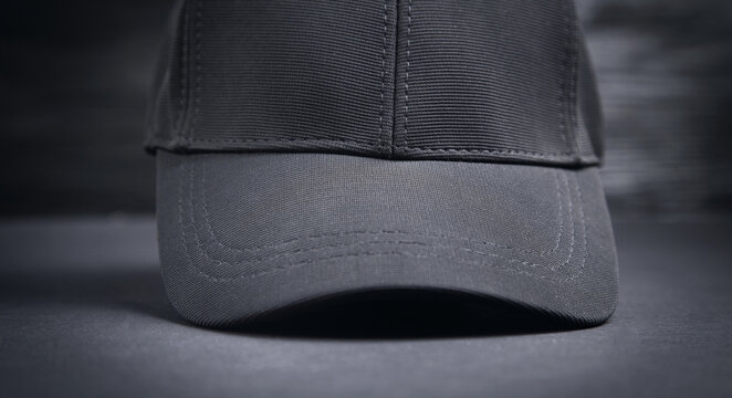 Baseball cap on the black background.