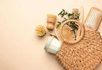 Zero waste lifestyle. Eco friendly bathroom and kitchen accessories on a beige background. Flat lay, top view, copy space.