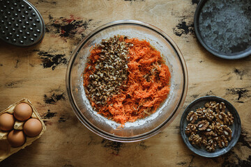 Apple carrot walnut loaf cake recipe. Ingredients in a bowl. Eggs, flour, sugar.