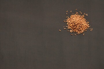 Cumin seeds isolated on black background