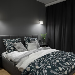 Stylish and dark bedroom with comfortable bed