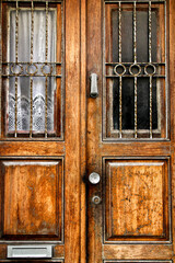 Old wooden door with wrought iron details