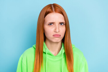 Photo of disgusted orange hairdo young lady wear green sweater isolated on blue color background