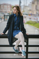 Obraz premium Autumn portrait of beautiful woman in sundress.