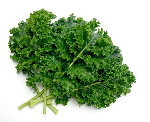 organic green kale leaves isolated on white background.