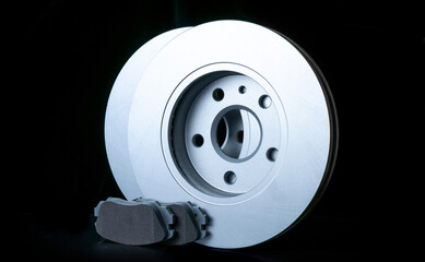 Repair service. Auto motor mechanic spare or automotive piece on black background. New metal car part. Repair and vehicle service with space for text.