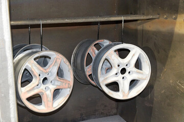 light-alloy car wheels in the chamber for heating before restoration and painting