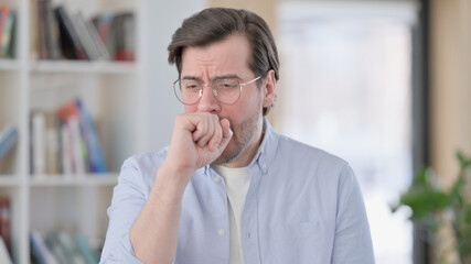 Portrait of Sick Man in Glasses Coughing