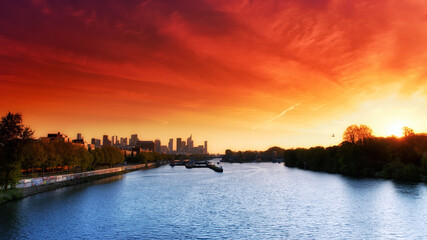 the Boulogne Wood and la Defense towers  sunrise  in Paris city