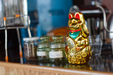 Neko is the longest lucky cat statue in a coffee shop.