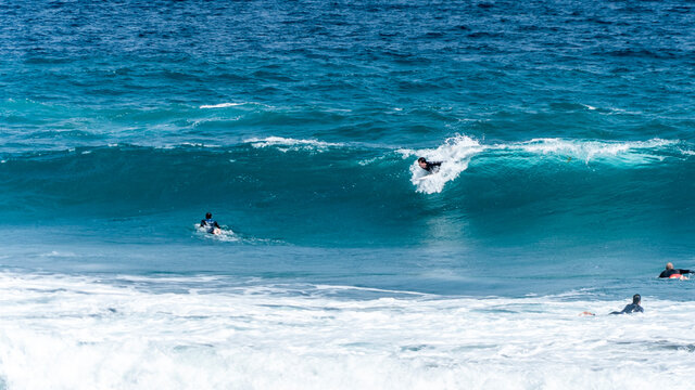surfing on the beach of la cicer in Las Plamas de Gran Canaria