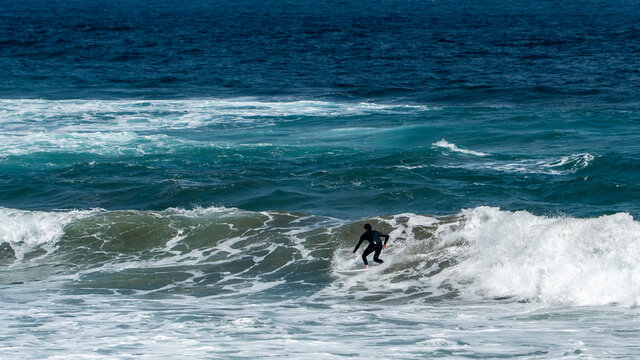 surfing on the beach of la cicer in Las Plamas de Gran Canaria
