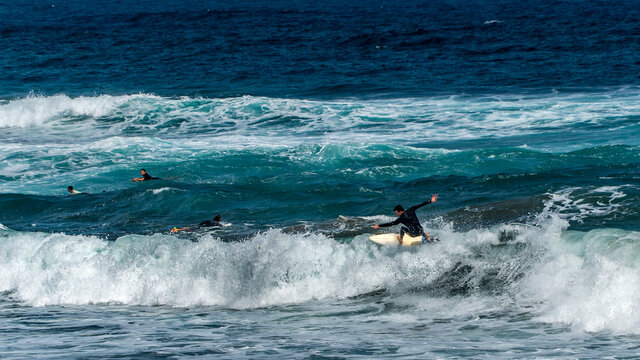 surfing on the beach of la cicer in Las Plamas de Gran Canaria