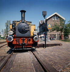 Obraz na płótnie Canvas Train station and Historic steam locomotive Medemblik Netherlands. Steam engine. Railroad. Nostalgia. Spoorlijn Hoorn - Medemblik