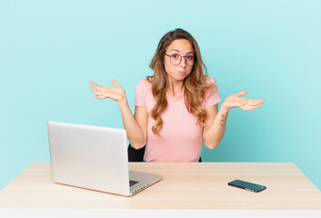 pretty woman feeling puzzled and confused and doubting. telework concept