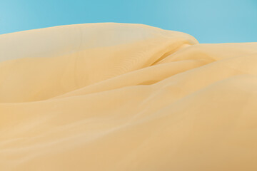 Yellow color tulle fabric texture  with beautiful closeup and elegance detail fabric background