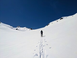  ski mountaineering on the sentisch horn from the fluela pass near davos klosters in the graubunden swiss mountains. ski