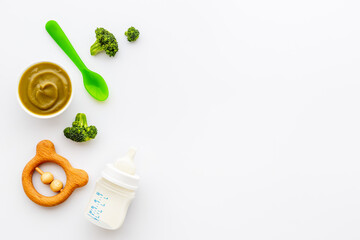 Fresh baby fruit food puree and milk bottle. Top view