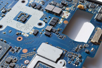 part of the motherboard for a laptop.blue color. chips and microchips