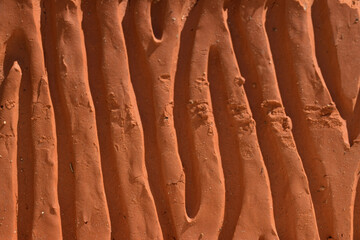 the uneven surface of the red brick.material for building construction - Powered by Adobe