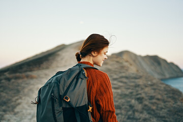 woman hiker in the mountains outdoors adventure backpack trail model