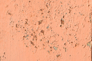 pink.peach scuffed paint. old coating