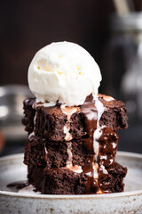 Chocolate brownies with vanilla ice cream on plate. Sweet sugary dessert - 435832155