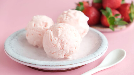 Strawberry ice cream scoops on a plate. Homemade pink strawberry ice cream, italian gelato