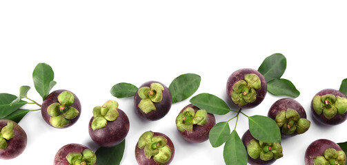 Fresh ripe mangosteen fruits with green leaves on white background, top view