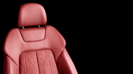 Modern luxury car red leather interior. Part of red perforated leather car seat details with white...