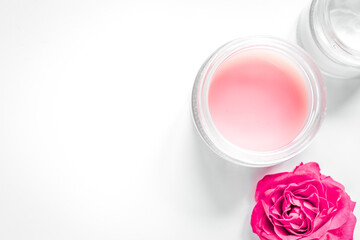 Nail care spa set with rose blossom, cream white background top view mockup