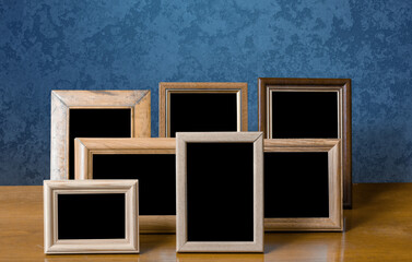 frames on table, blue wall