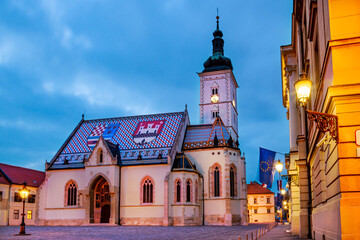 Fototapeta na wymiar Front wide view of the religious parish Saint Mark Church at the blue hour in Zagreb in Croatia