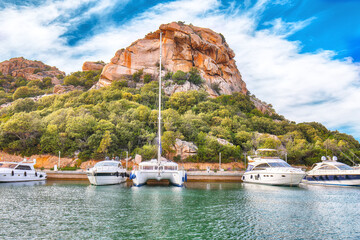 Enchanting view of Poltu Quatu port and bay with luxury yachts on