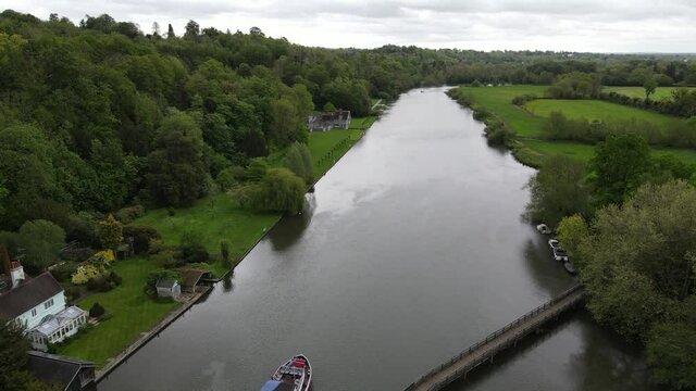 Marsh Lock on River Thames UK large boat leaving lock Aerial footage