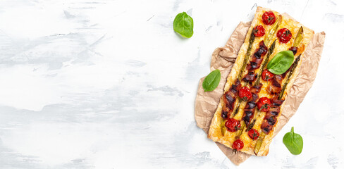 Slice of delicious home made asparagus quiche with bacon,