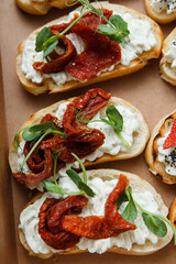 
A set of different snacks for a party or a festive table. Ciabatta sandwiches with tomatoes,...