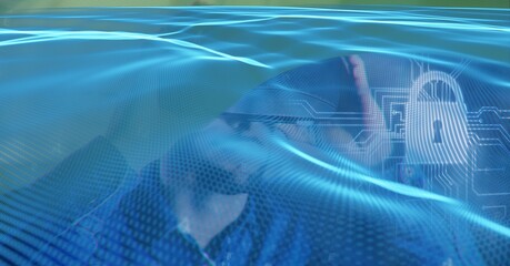 Composition of blue light trails and online security padlock over man wearing vr headset