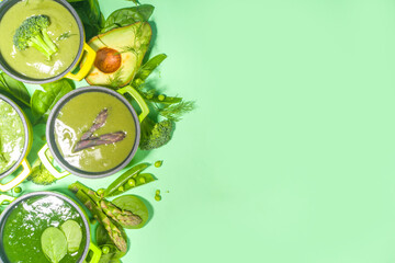 Green cream-soup set. Variety of classic green vegetable soups, in small portioned pots -...