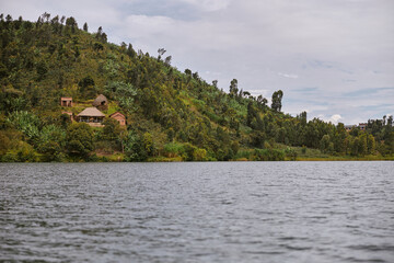 Tropical landscape with woods and lake in east african country