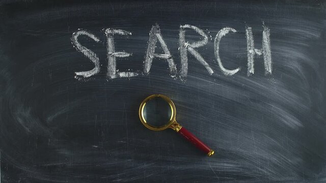 Word the search is written by hand chalk on a chalkboard and put magnifying glass, timelapse. Concept of search and quest.