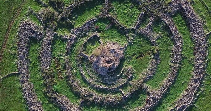 Aerial Top Shot Of Concentric Circle On Green Land, Drone Flying Downwards Over Famous Landscape - Golan, Israel