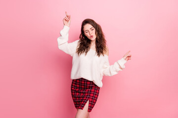 Portrait of positive charming person closed eyes point fingers have good mood isolated on pink color background