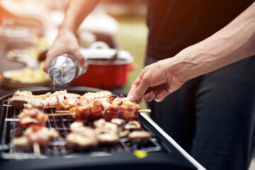 Obraz na płótnie Canvas Preparing barbeque on a electrical modern grill outdoors.