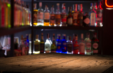 Classic bar counter with bottles in blurred background