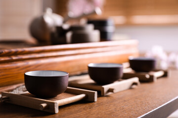 Cups for traditional tea ceremony on wooden table