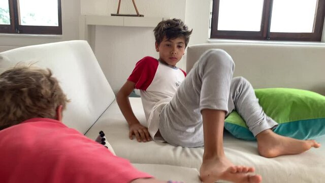 Two brothers quarreling, siblings fighting each other, authentic real life brother fight